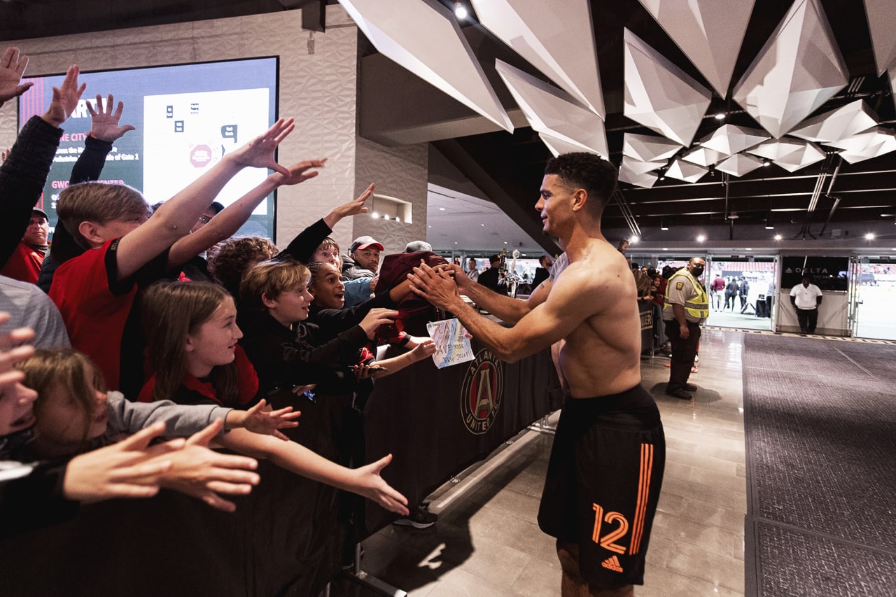 Atlanta United defender Miles Robinson #12 gives his jersey to supporters after the match against Toronto FC at Mercedes-Benz Stadium in Atlanta, Georgia on Saturday October 30, 2021. (Photo by Jacob Gonzalez/Atlanta United)