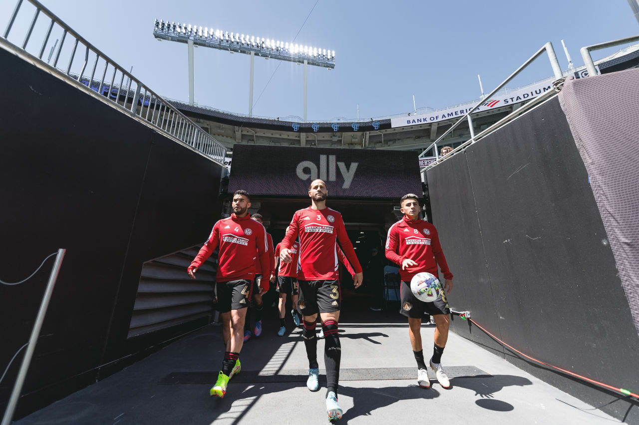 Atlanta United forward Dom Dwyer #4, defender Alex De John #3, and midfielder Thiago Almada #8 head out to the pitch to warm up before the match against Charlotte FC at Bank of America Stadium in Charlotte, United States on Sunday April 10, 2022. (Photo by Dakota Williams/Atlanta United)