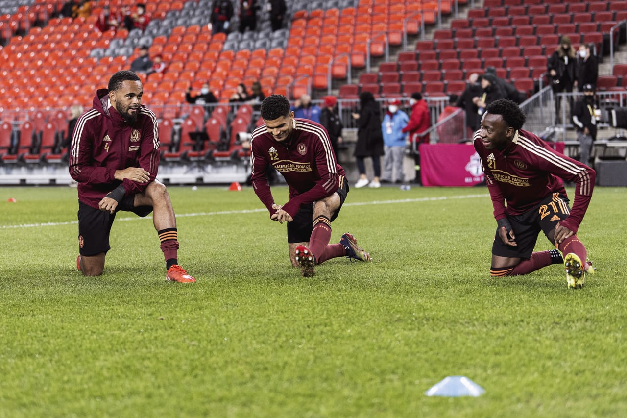 Atlanta United defender Anton Walkes #4, defender Miles Robinson #12 and defender George Bello #21 warm up before the match against Toronto FC at BMO Training Ground in Toronto, Ontario on Saturday October 16, 2021. (Photo by Jacob Gonzalez/Atlanta United)