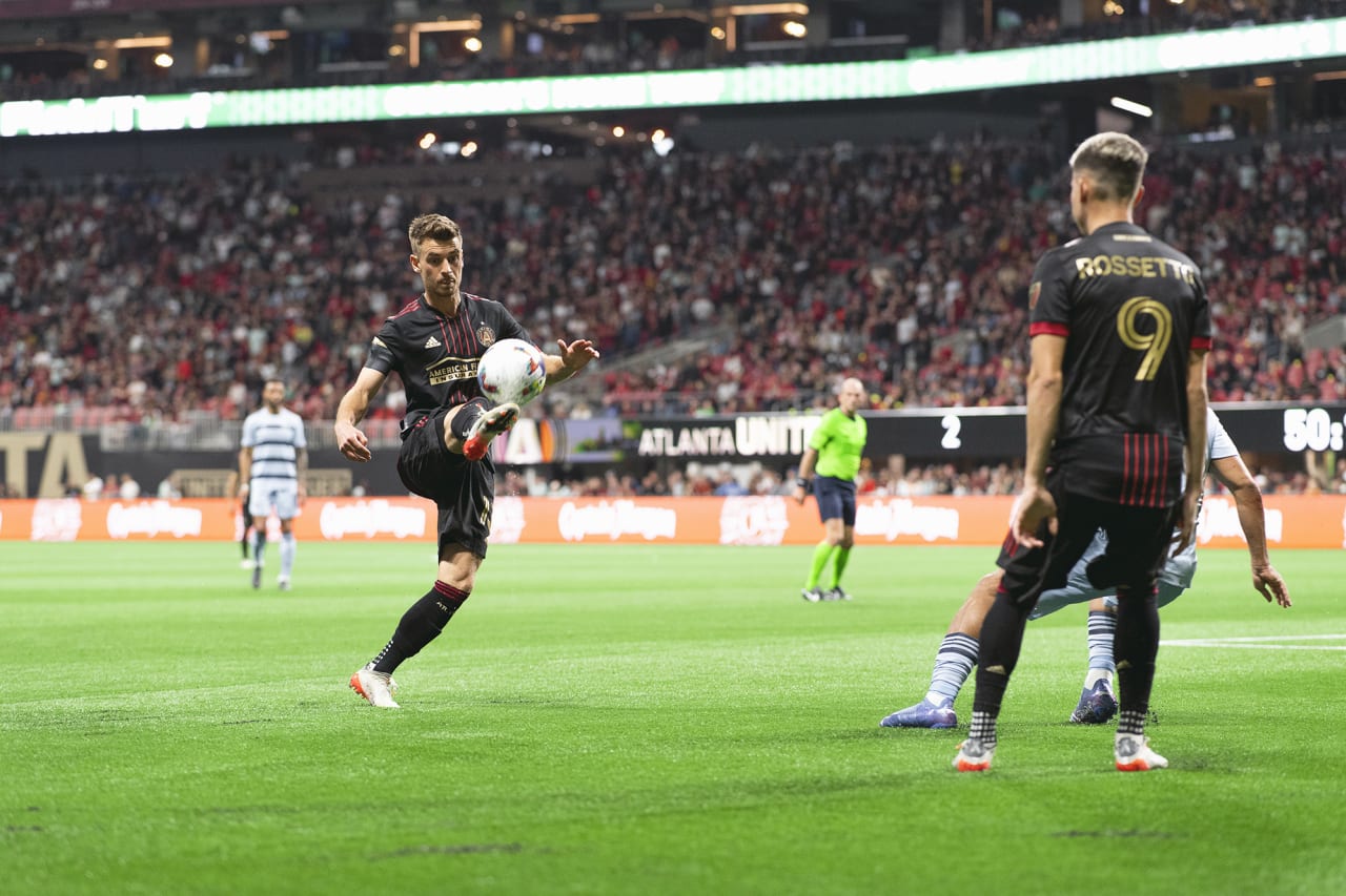Atlanta United midfielder Amar Sejdic #13 goes up for the ball during the 2022 Opening Day match against Sporting Kansas City at Mercedes-Benz Stadium in Atlanta, United States on Sunday February 27, 2022. (Photo by Jacob Gonzalez/Atlanta United)