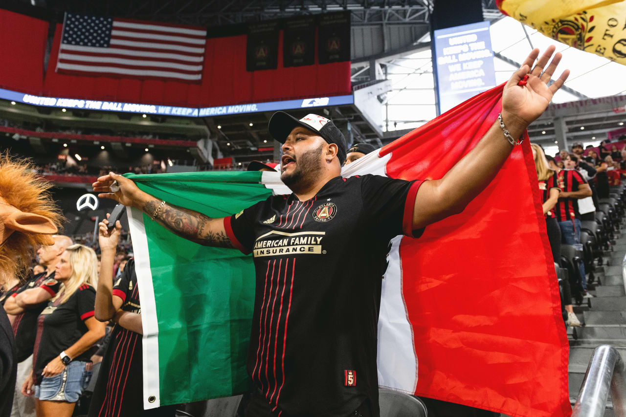 A fan holds a Mexican flag during the match against CF Pachuca at Mercedes-Benz Stadium in Atlanta, Georgia, on Tuesday June 14, 2022. (Photo by Jay Bendlin/Atlanta United)