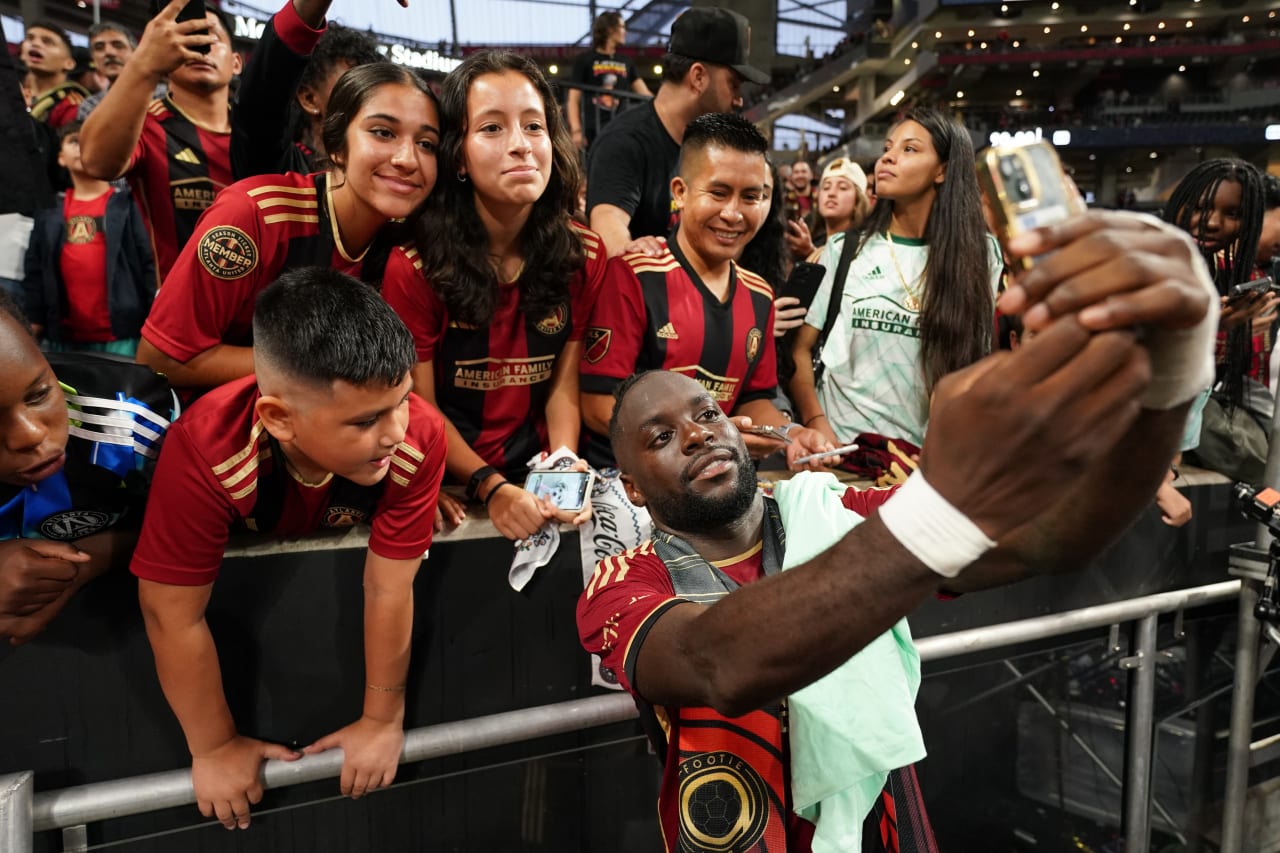 Atlanta United midfielder Tristan Muyumba #8 takes a photo with supporters after the victory against Inter Miami at Mercedes-Benz Stadium in Atlanta, GA on Saturday, September 16, 2023. (Photo by Matthew Grimes/Atlanta United)