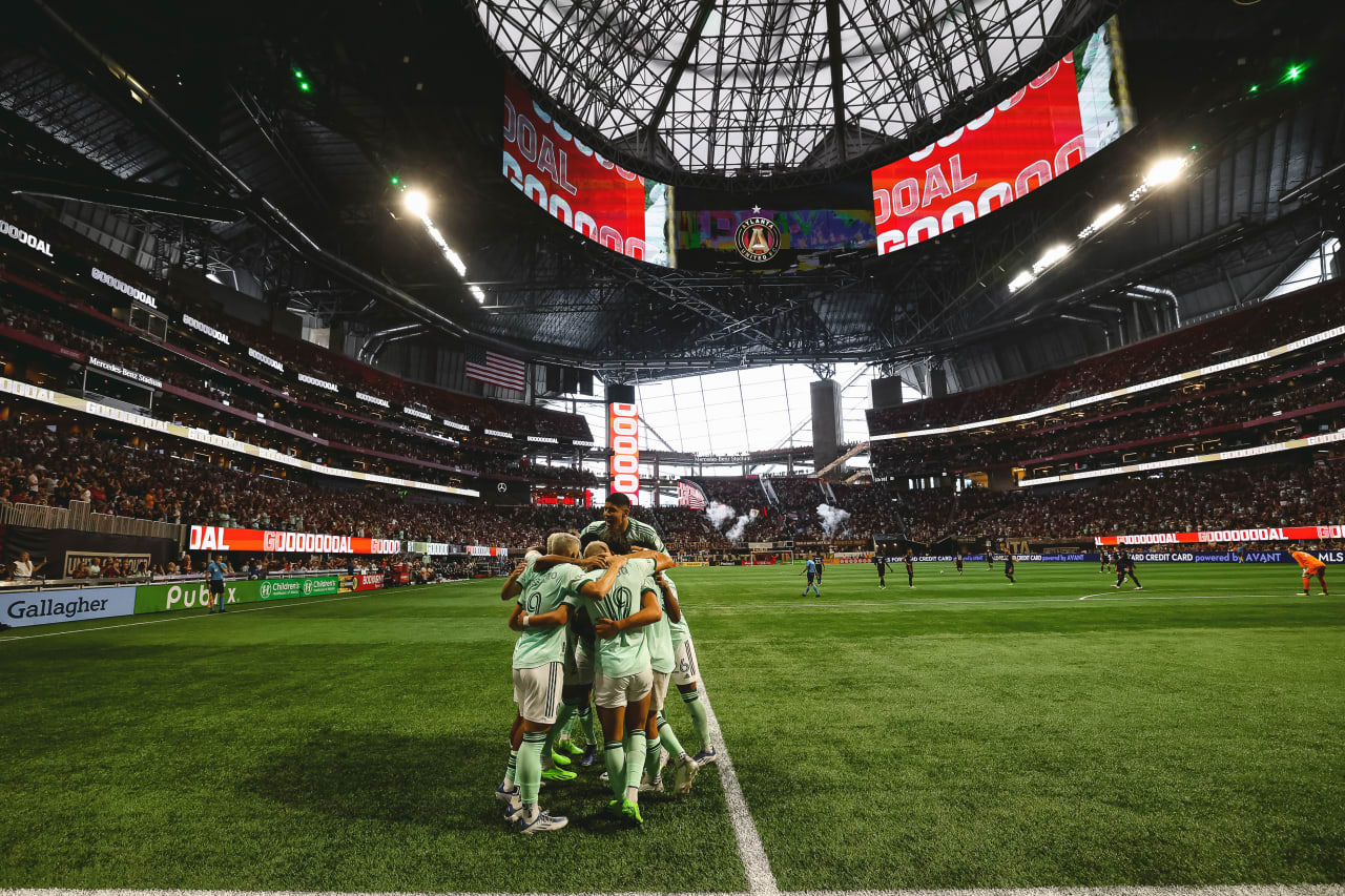 Atlanta United forward Ronaldo Cisneros #29 celebrates with teammates after scoring a goal during the first half of the match against Seattle Sounders FC at Mercedes-Benz Stadium in Atlanta, United States on Saturday August 6, 2022. (Photo by Karl Moore/Atlanta United)