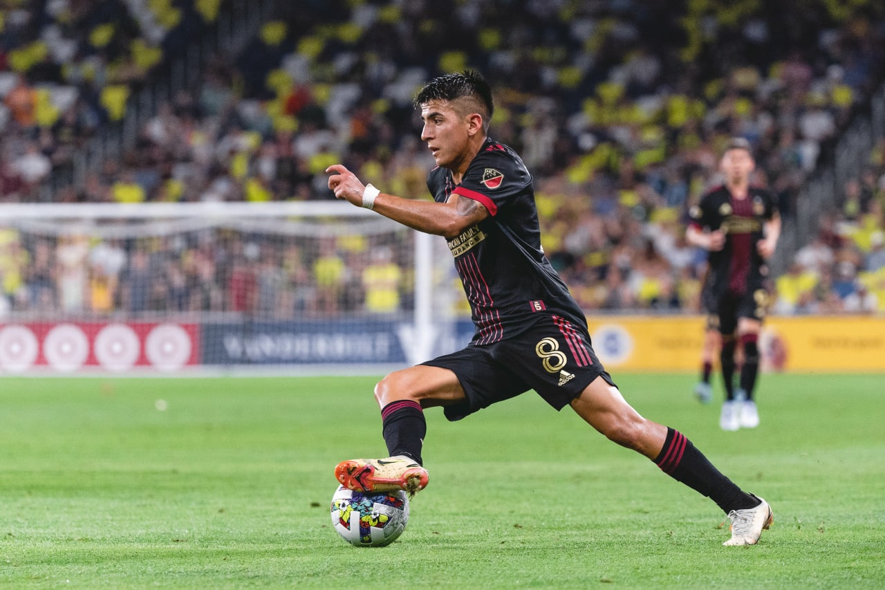 Atlanta United midfielder Thiago Almada #8 dribbles the ball during the Lamar Hunt U.S. Open Cup match against Nashville SC at Geodis Park in Nashville, Tennessee, on Wednesday May 11, 2022. (Photo by Dakota Williams/Atlanta United)
