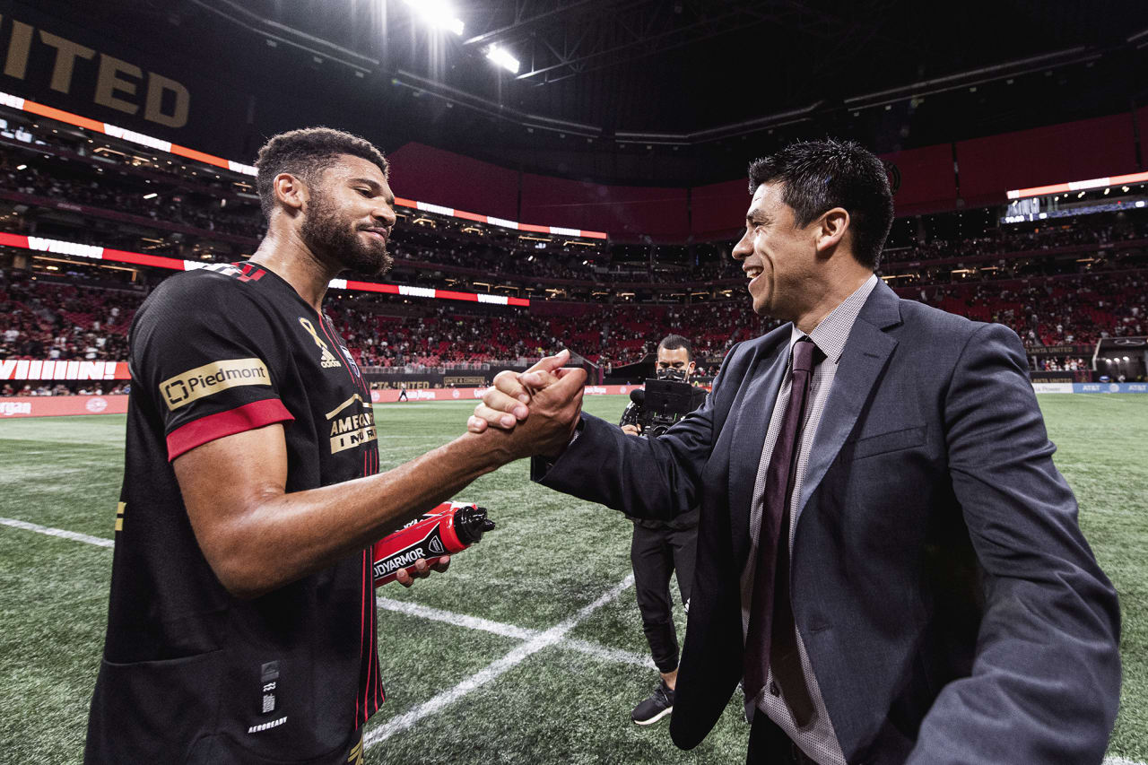 Atlanta United defender George Campbell #32 celebrates with Head Coach Gonzalo Pineda after the match against Orlando City at Mercedes-Benz Stadium in Atlanta, Georgia on Friday September 10, 2021. (Photo by Jacob Gonzalez/Atlanta United)