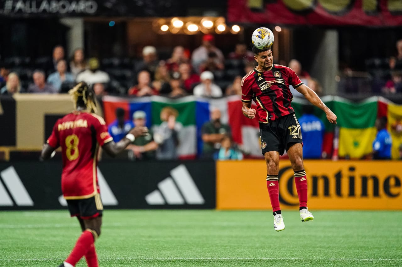 Atlanta United defender Miles Robinson #12 heads the ball during the first half of the match against Inter Miami at Mercedes-Benz Stadium in Atlanta, GA on Saturday, September 16, 2023. (Photo by Matthew Grimes/Atlanta United)