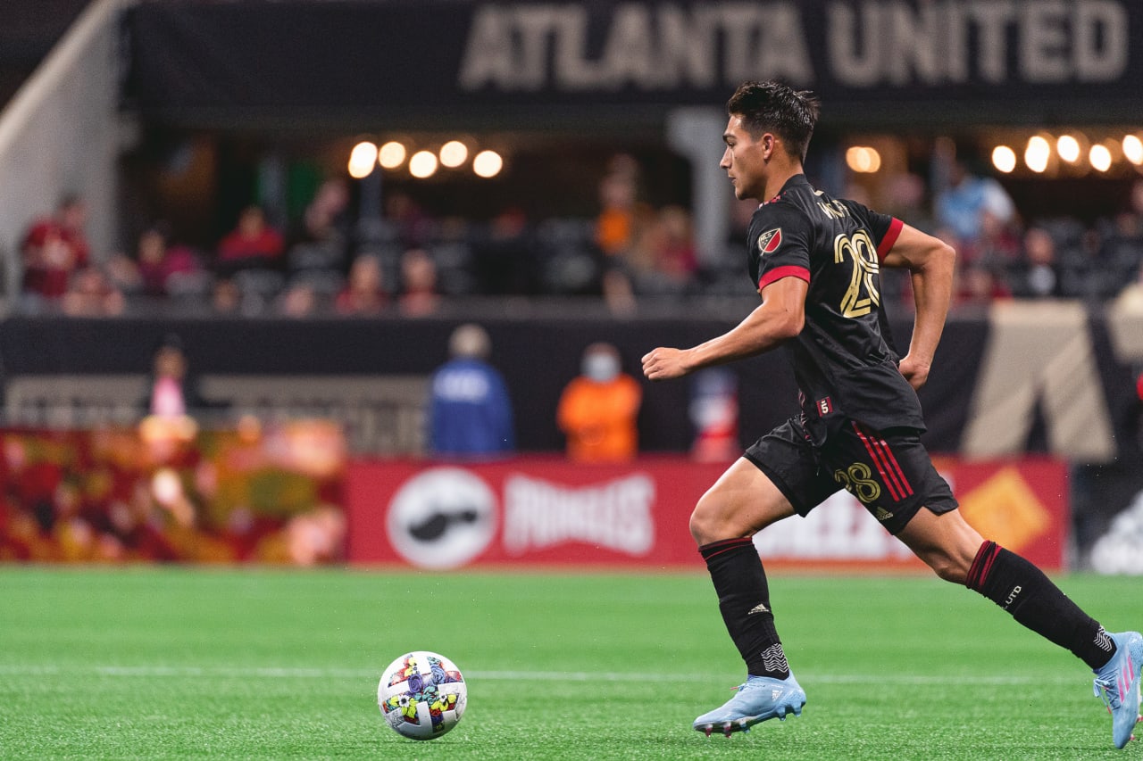 Atlanta United forward Tyler Wolff #28 dribbles the ball during the 2022 Opening Day match against Charlotte FC at Mercedes-Benz Stadium in Atlanta, United States on Sunday March 13, 2022. (Photo by Dakota Williams/Atlanta United)