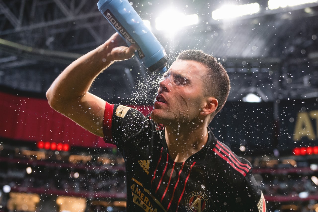 Atlanta United defender Brooks Lennon #11 sprays water on his face before the match against CF Montreal at Mercedes-Benz Stadium in Atlanta, United States on Saturday March 19, 2022. (Photo by Dakota Williams/Atlanta United)