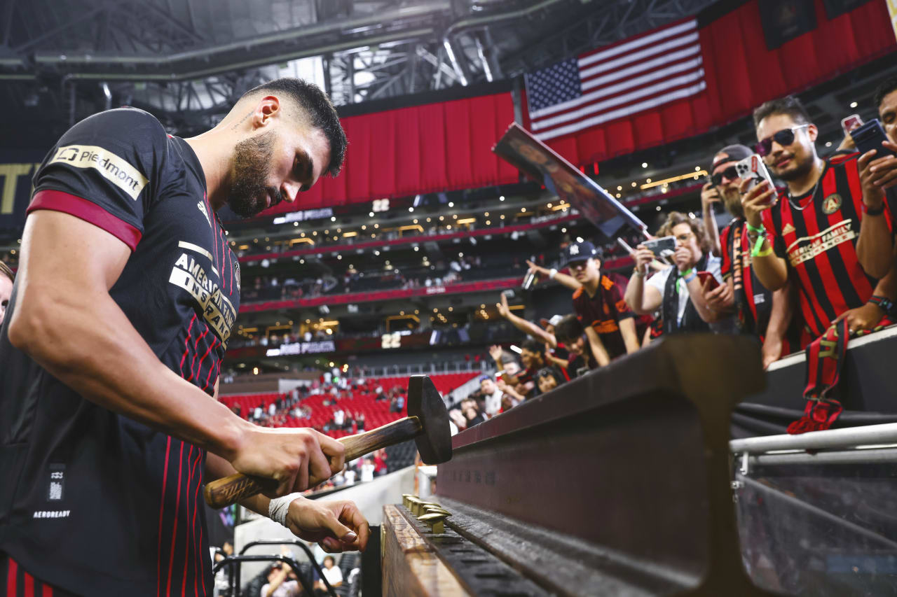 Atlanta United defender Juan José Sanchez Purata #22 is awarded the golden spike of excellence after the match against Orlando City at Mercedes-Benz Stadium in Atlanta, United States on Sunday July 17, 2022. (Photo by Casey Sykes/Atlanta United)