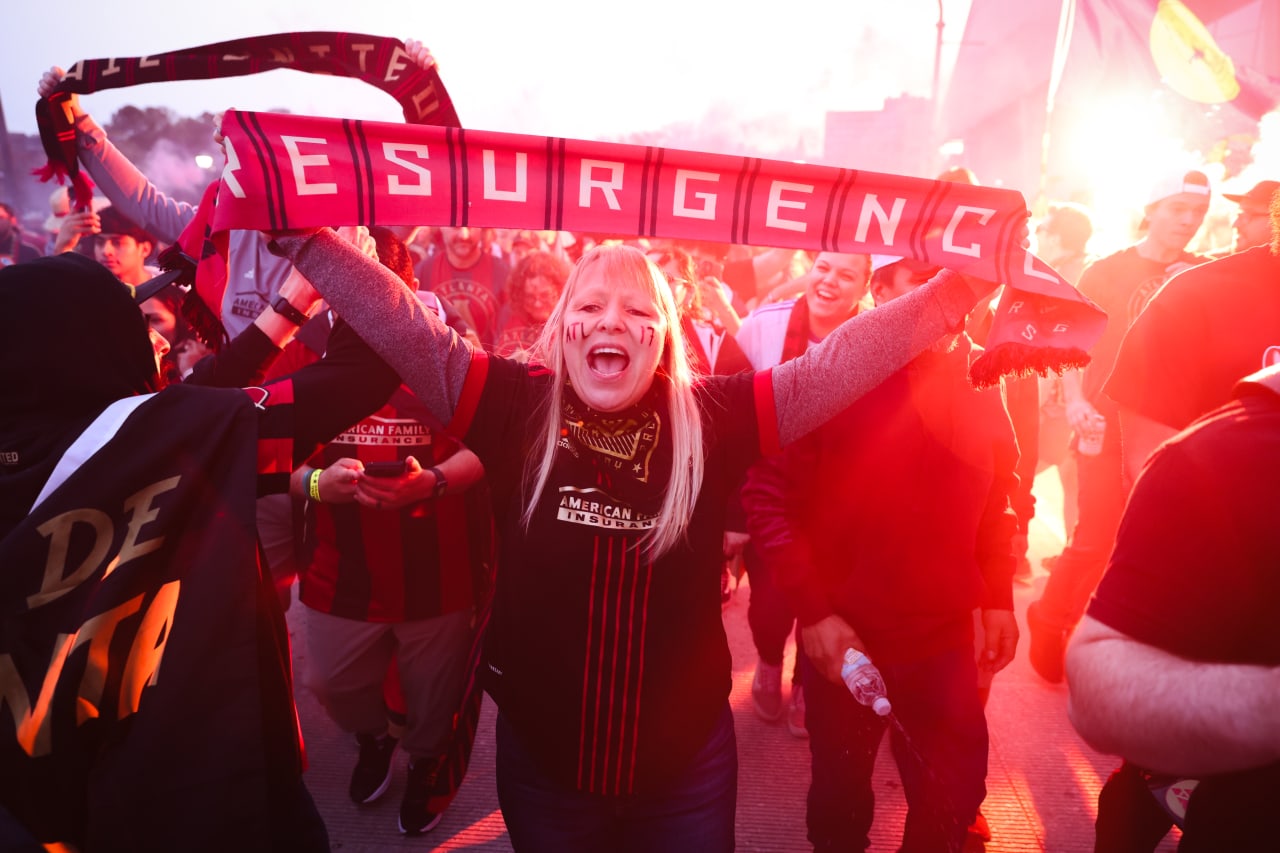 A supporter holds up a scarf at the supporters’ march before the match against New England Revolution at Mercedes-Benz Stadium in Atlanta, Ga. On Saturday, March 9, 2024