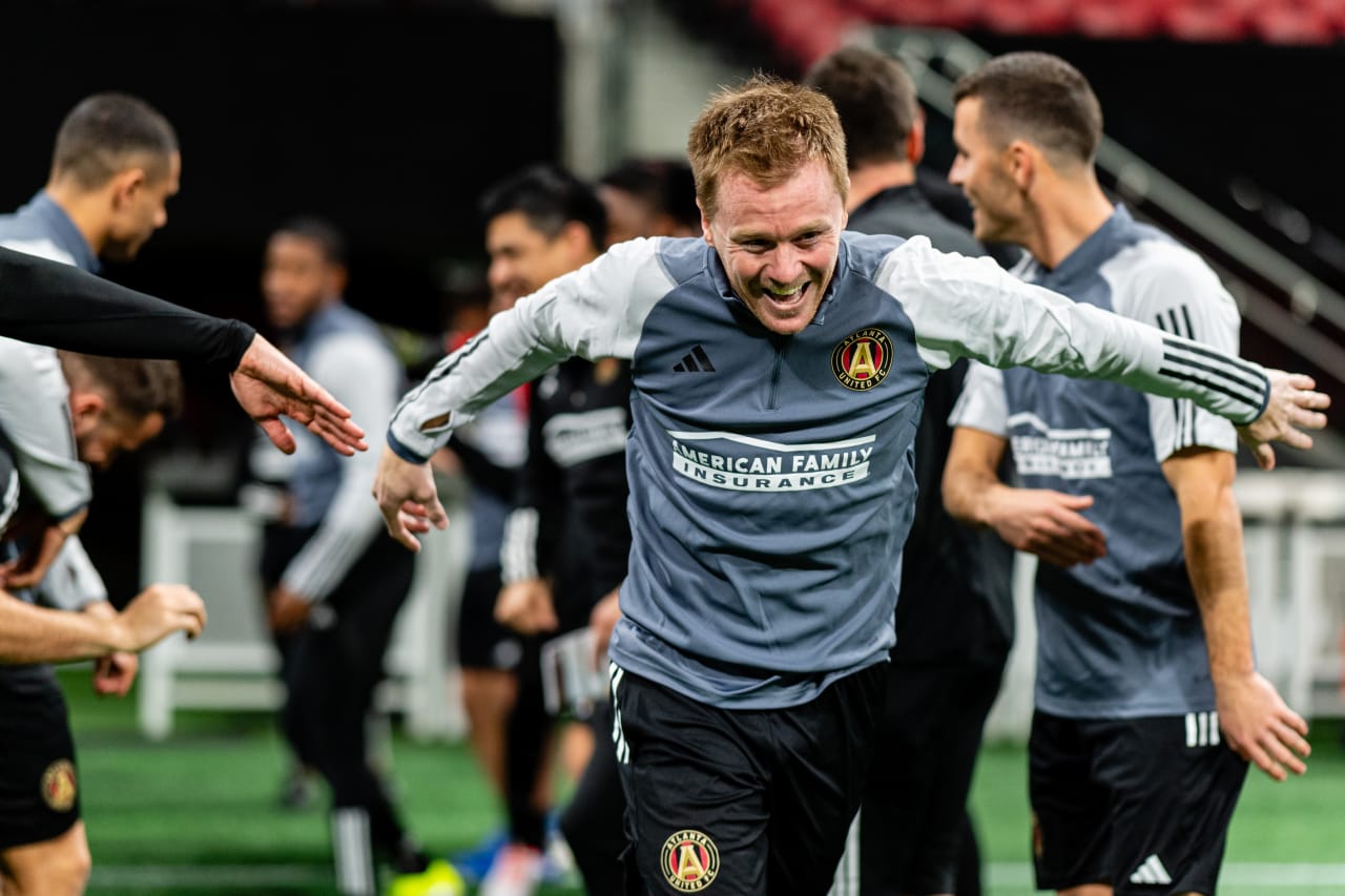 Atlanta United midfielder Dax McCarty runs through the tunnel during the first day of training at Mercedes-Benz Stadium in Atlanta, Ga. on Monday, January 15, 2024.