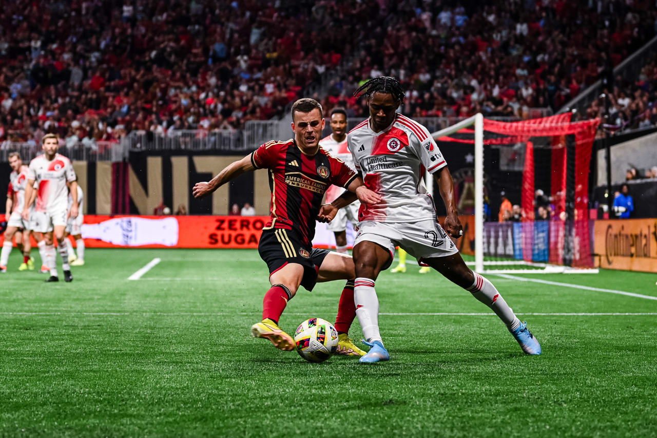 Atlanta United defender Brooks Lennon #11 dribbles the ball during the match against New England Revolution at Mercedes-Benz Stadium in Atlanta, GA on Saturday March 9, 2024