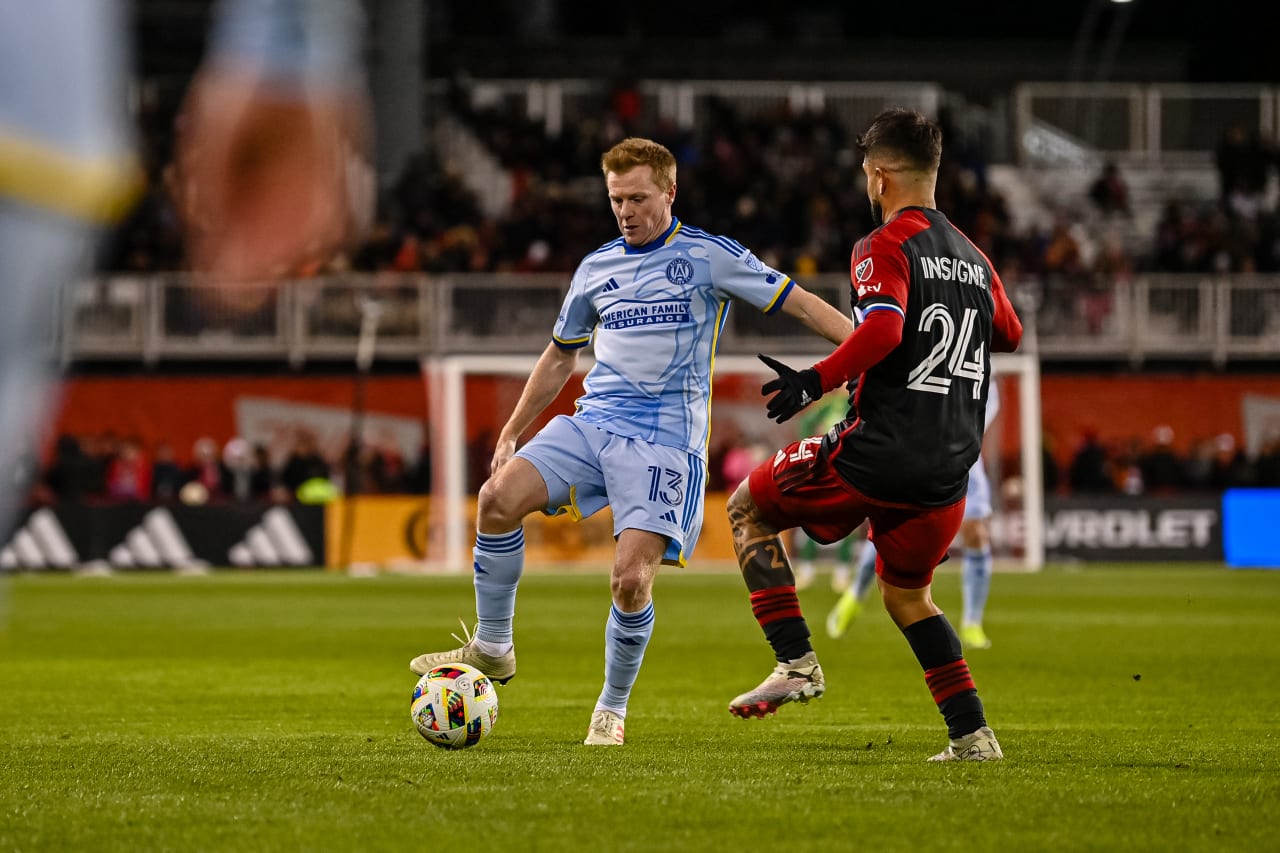 Atlanta United midfielder Dax McCarty #13 dribbles during the first half of the match against Toronto FC at BMO Field in Toronto, Canada on Saturday March 23, 2024