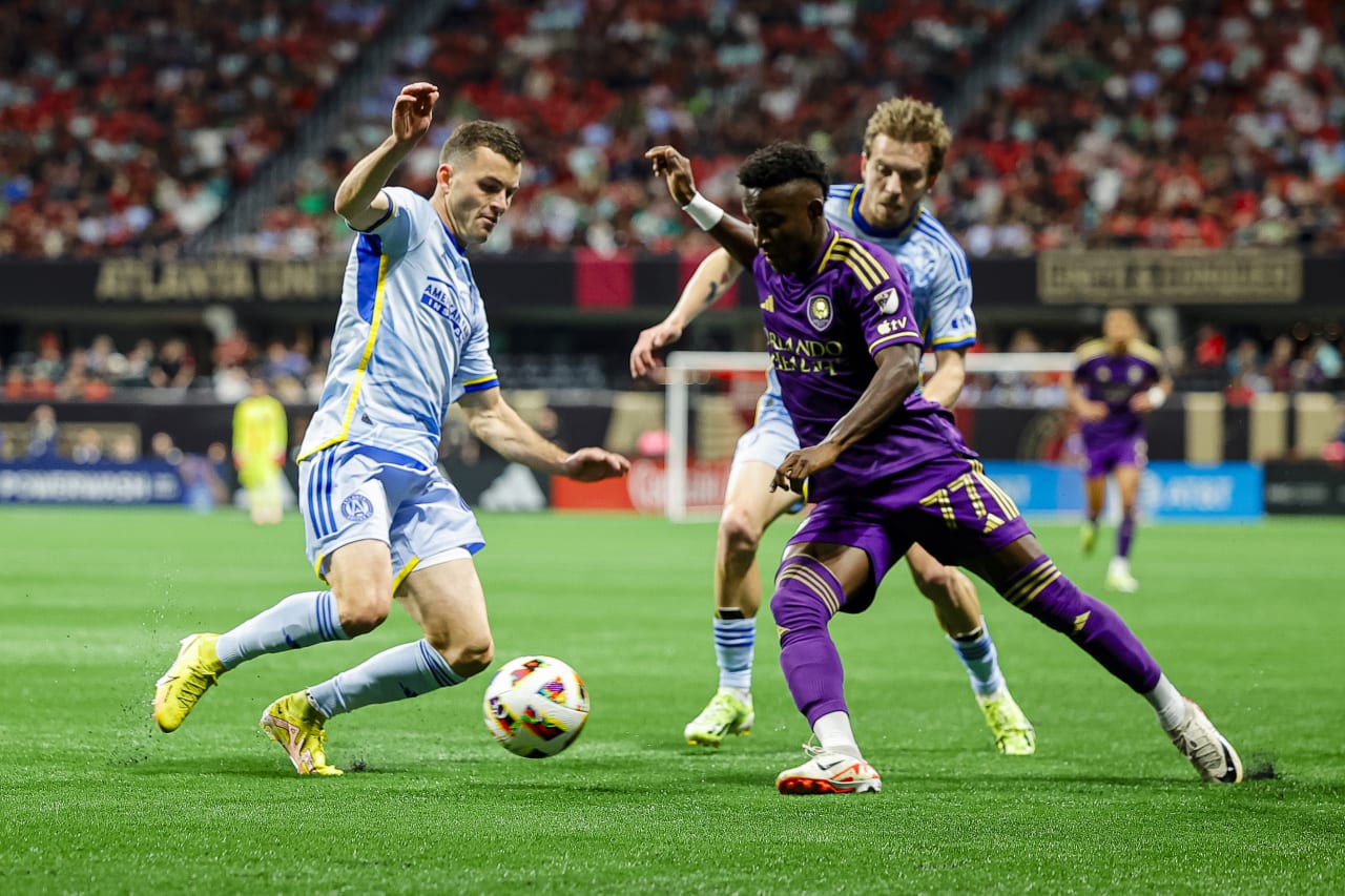 Atlanta United defender Brooks Lennon #11 challenges for the ball during the first half of the match against Orlando City at Mercedes-Benz Stadium in Atlanta, GA on Sunday March 17, 2024
