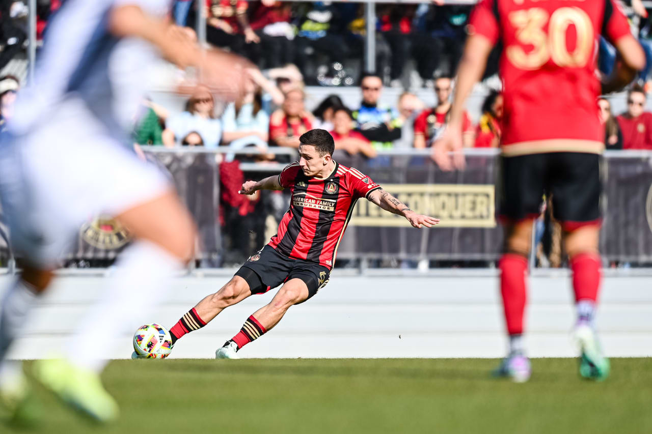 Atlanta United midfielder Bartosz Slisz #6 kicks the ball during the first half of the match against Memphis 901 FC at Turner Sports Complex in Athens, GA on Saturday February 3, 2024