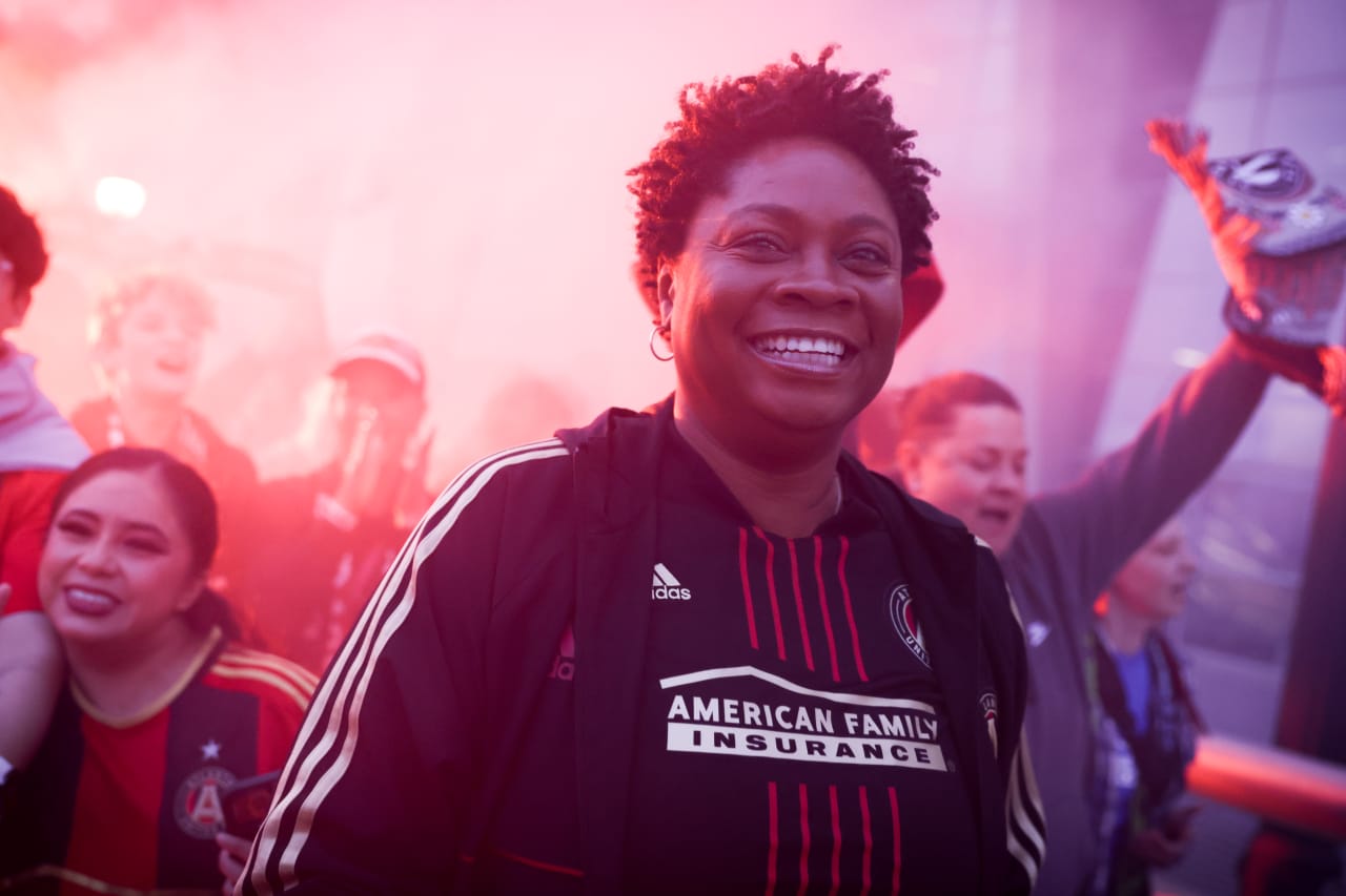 A supporter smiles at the supporters’ march before the match against New England Revolution at Mercedes-Benz Stadium in Atlanta, Ga. On Saturday, March 9, 2024