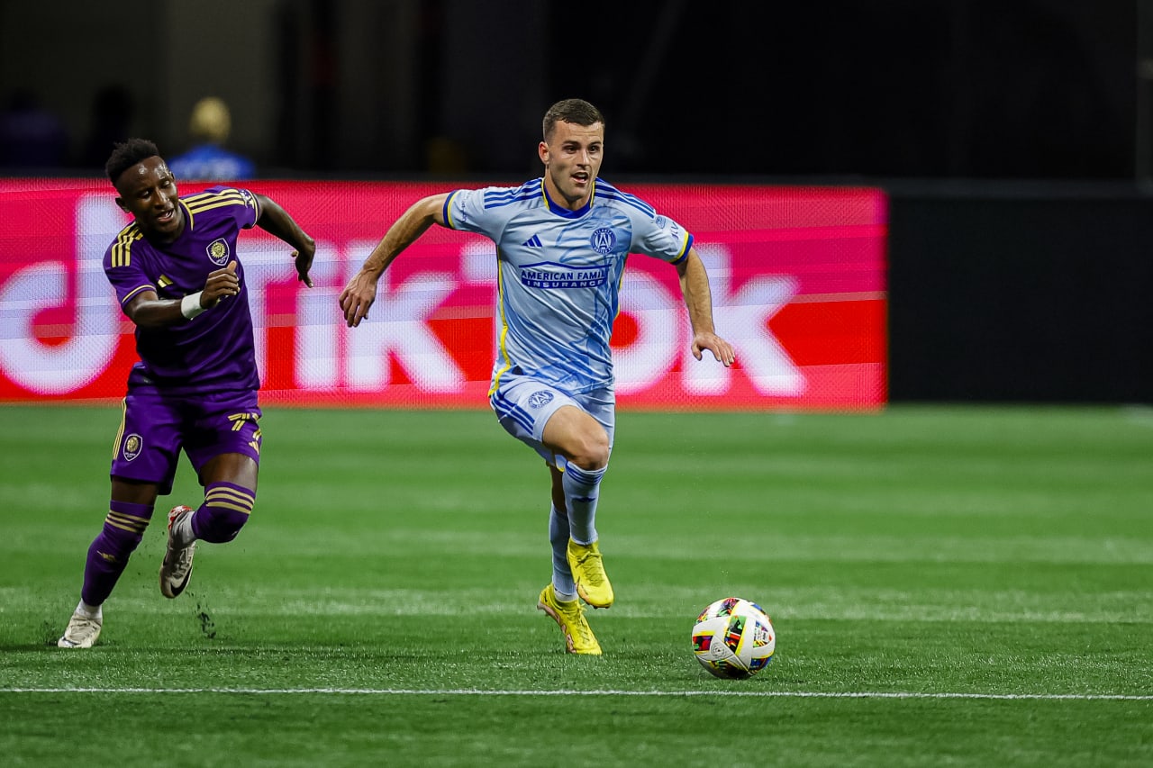 Atlanta United defender Brooks Lennon #11 dribbles during the second half of the match against Orlando City at Mercedes-Benz Stadium in Atlanta, GA on Sunday March 17, 2024