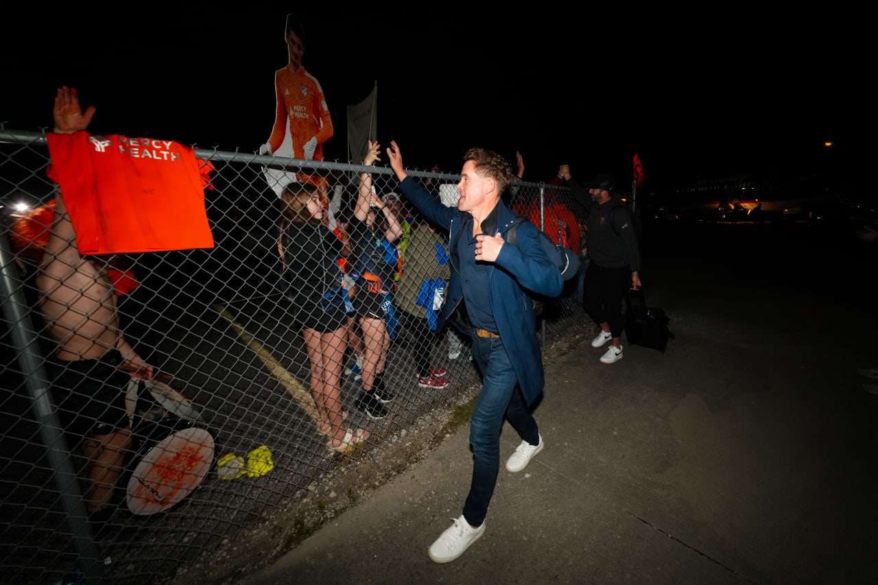 CINCINNATI, OHIO - NOVEMBER 5: FC Cincinnati celebrates with supporters after winning Round One Best of 3 of the MLS Cup Playoffs at Lunken Airport in Cincinnati, Ohio. (FC Cincinnati)