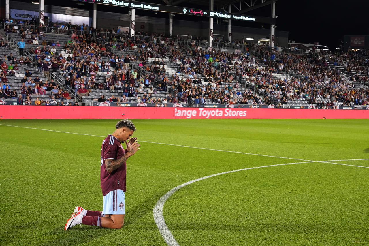 Rafael Navarro kneels in prayer before kickoff against Austin FC at DICK'S Sporting Goods Park (Photo by Garrett Ellwood)