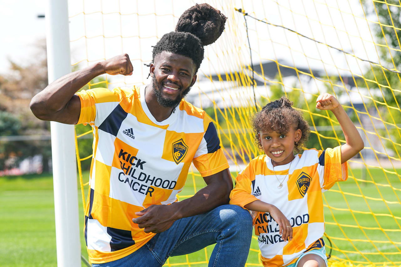 Kid Captain River Raven and 2021 Kid Captain Gabby James model the Kick Childhood Cancer pre-match tops with Colorado Rapids defender Lalas Abubakar and striker Gyasi Zardes. (Photos by Bart Young)