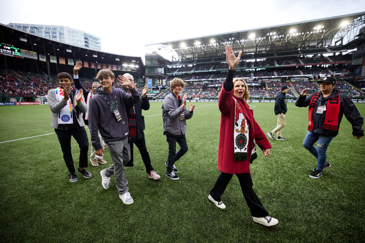 RAJ Sports NWSL Governor Lisa Bathal Merage and her family greet the crowd during pregame festivities.