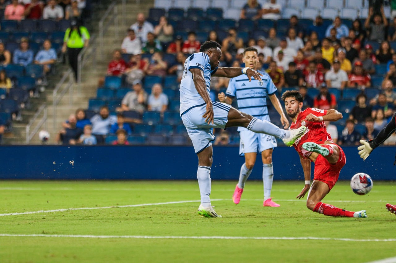 Willy Agada takes the shot in front of the Toluca keeper on Aug. 4.