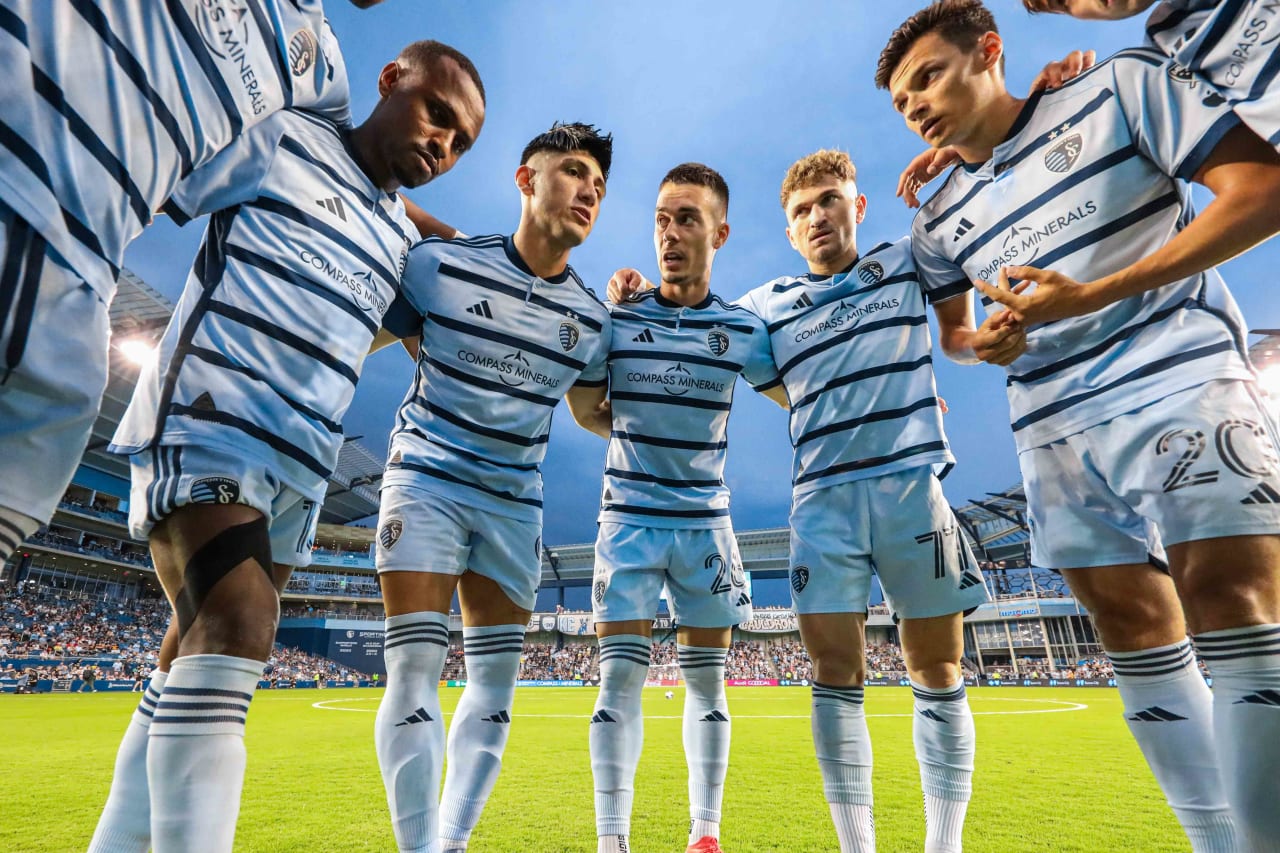 Sporting KC players listen to the pre-match speech ahead of kickoff.