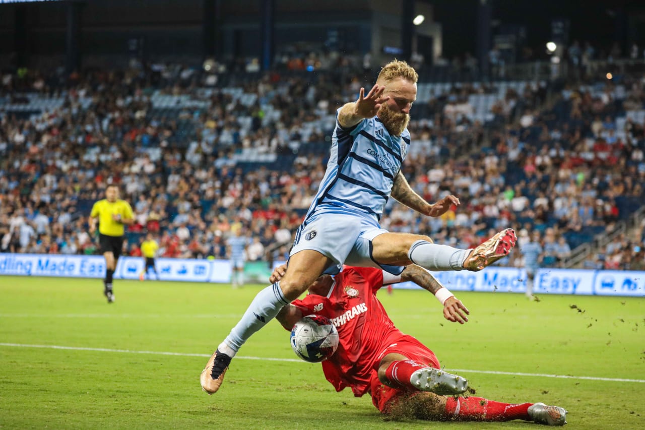 Johnny Russell avoids a Toluca defender during the Aug. 4 match.