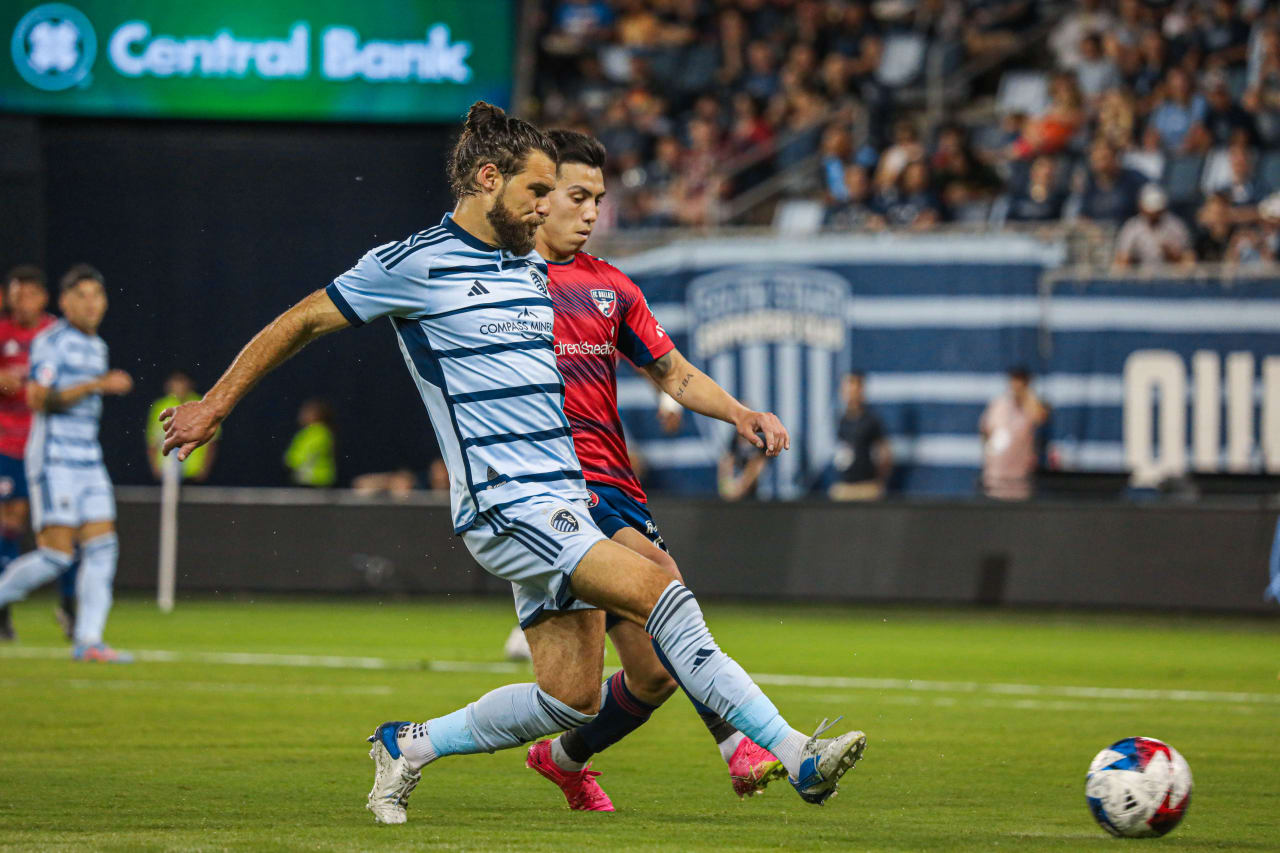 Graham Zusi keeps the back line clear during the match against FC Dallas.