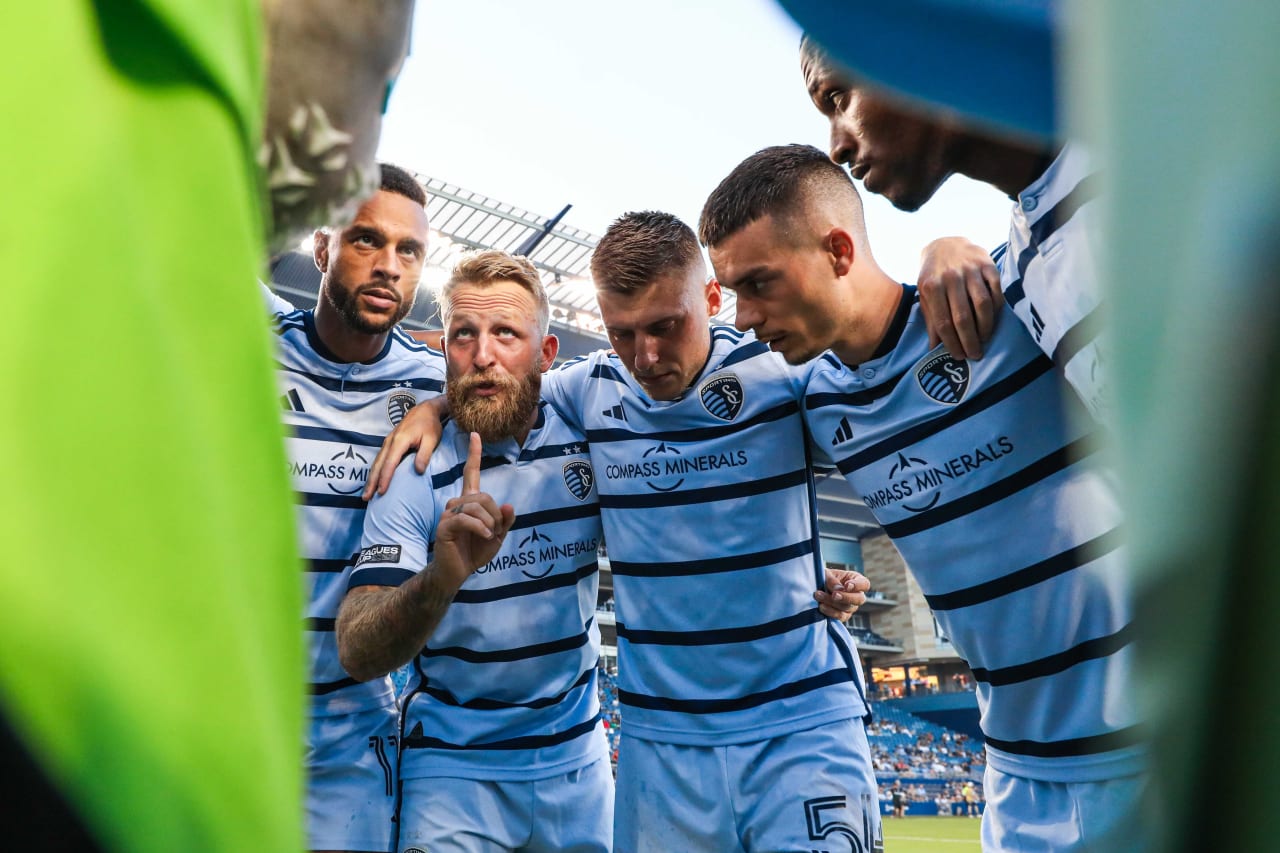 Capitan Johnny Russell leads the huddle speech before kick-off on Aug. 4.