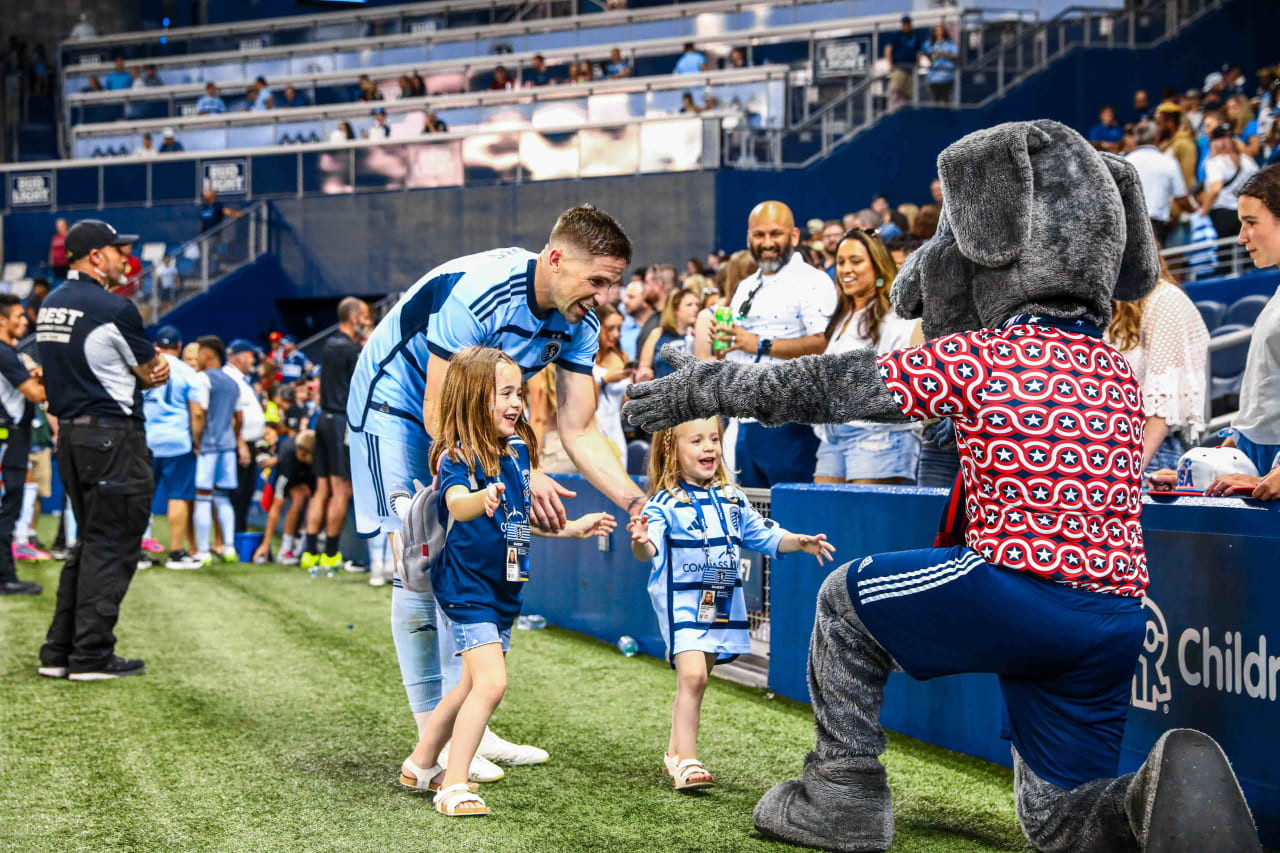 Blue celebrates the Sporting KC win with defense Andreu Fontàs and family.