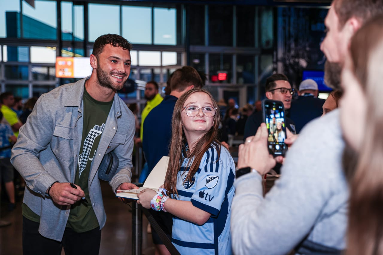 Keeper, John Pulskamp takes selfies with supporter as he makes his way into Children's Mercy Park on Mar. 2.