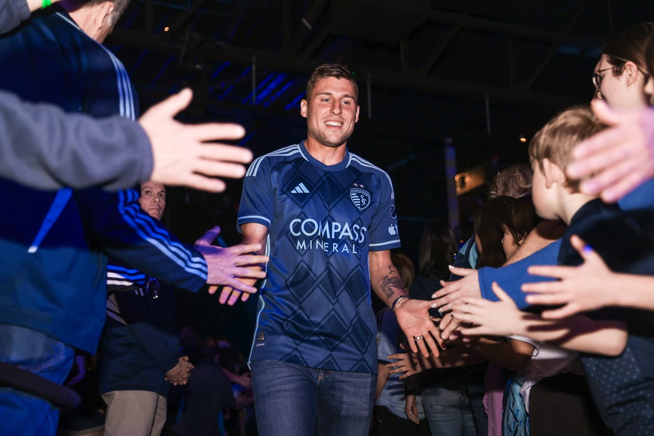 Midfielder, Remi Walter high-fives supporters as he makes his way onstage at the Season Kickoff Party.