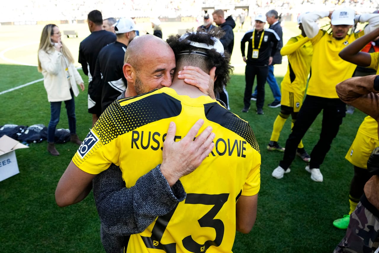 Crew 2 head coach Laurent Courtois and MLS NEXT Pro regular season MVP Jacen Russell-Rowe embrace after their team's MLS NEXT Pro Cup victory