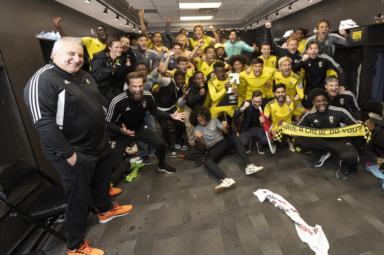 Crew 2 celebrates their Eastern Conference Final win in their locker room