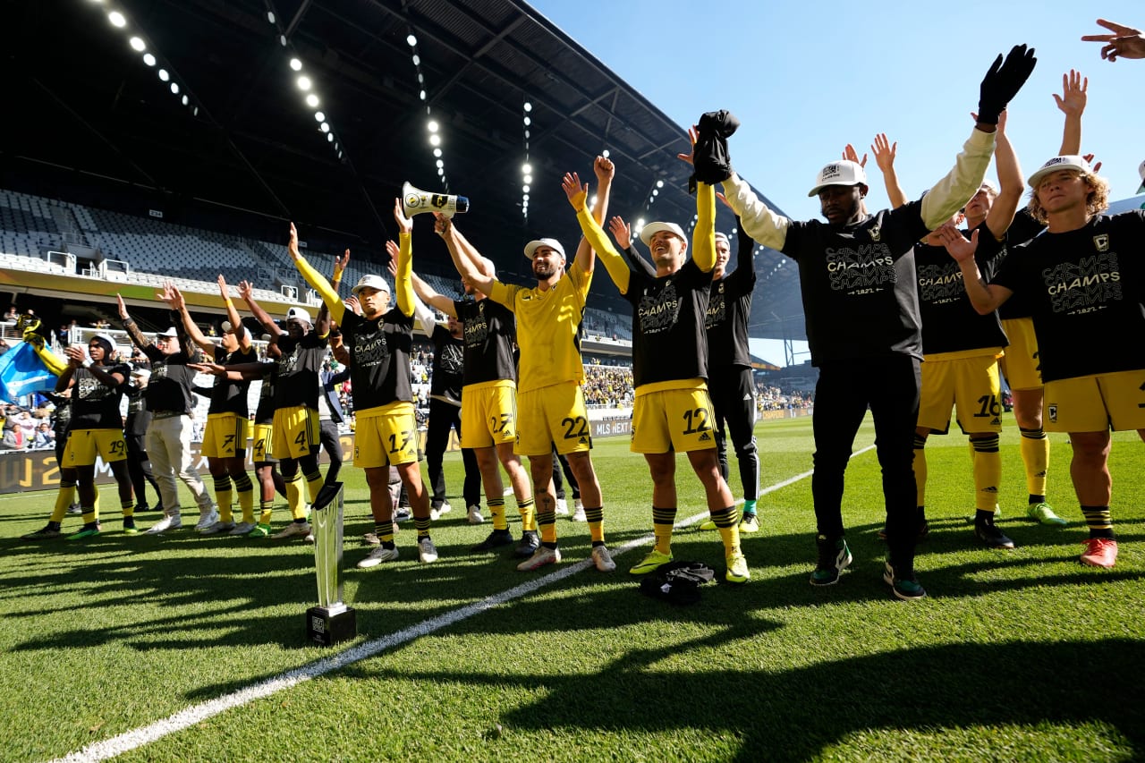 Crew 2 players celebrate with the trophy and fans after winning the MLS NEXT Pro Cup