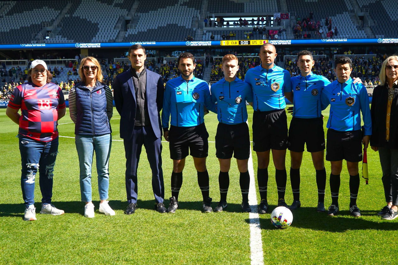 Referees posing for a picture with MLS NEXT Pro dignitaries ahead of MLS NEXT Pro Cup