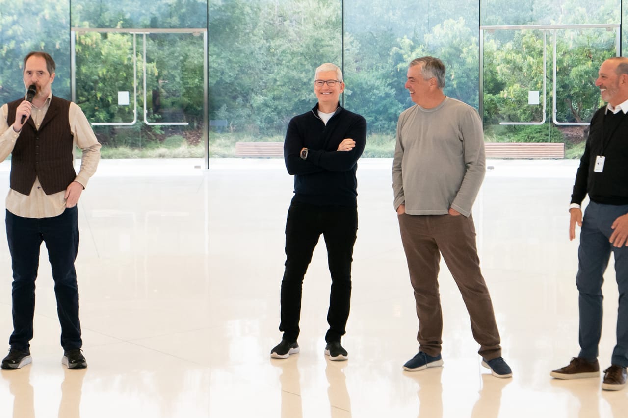 Actor Brendan Hunt (Coach Beard from Ted Lasso) speaks while Apple CEO Tim Cook, Apple Senior Vice President Services Eddy Cue and MLS Commissioner Don Garber look on at Apple Park on Jan. 11, 2023.