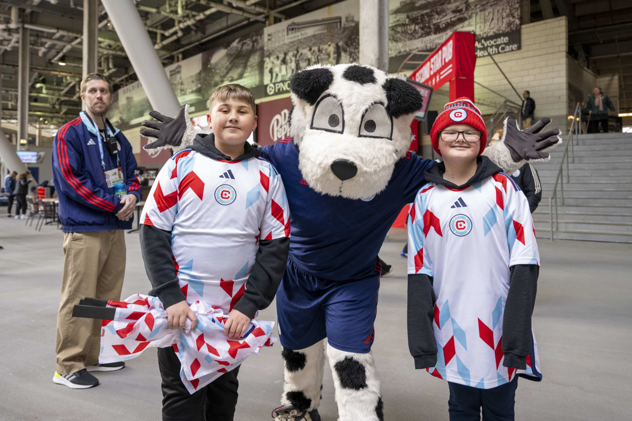 Sparky posing with young fans before the match!