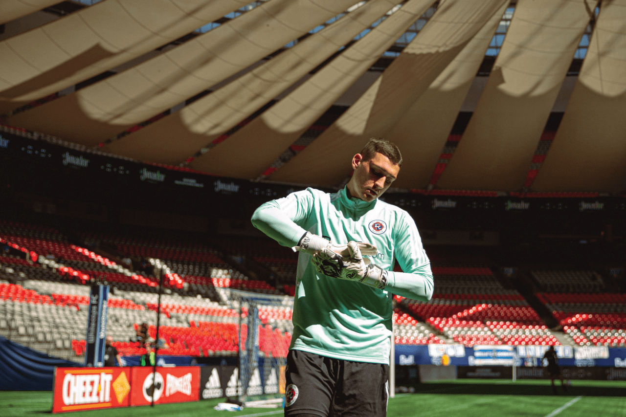 Djordje warms up before the match. Photo By: Beau Chevalier