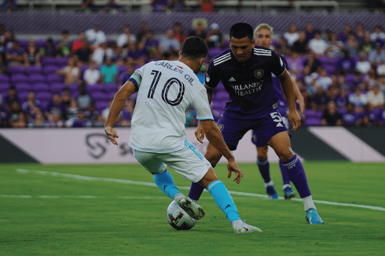 Gil looks to slip past the Orlando man. Photos By: Conor Kvatek