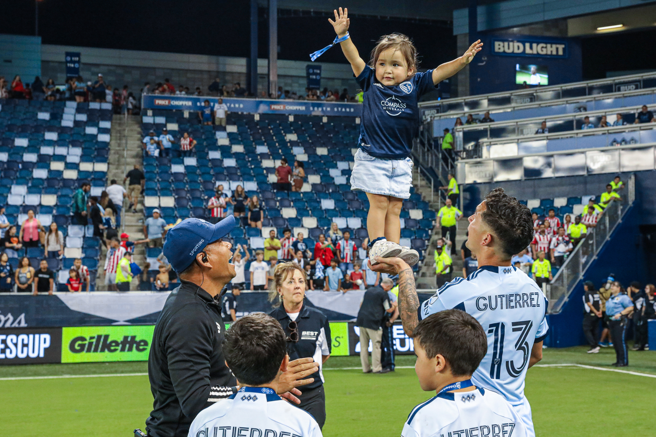 Midfielder, Felipe Gutierrez celebrates with his family post-match Jul. 31.